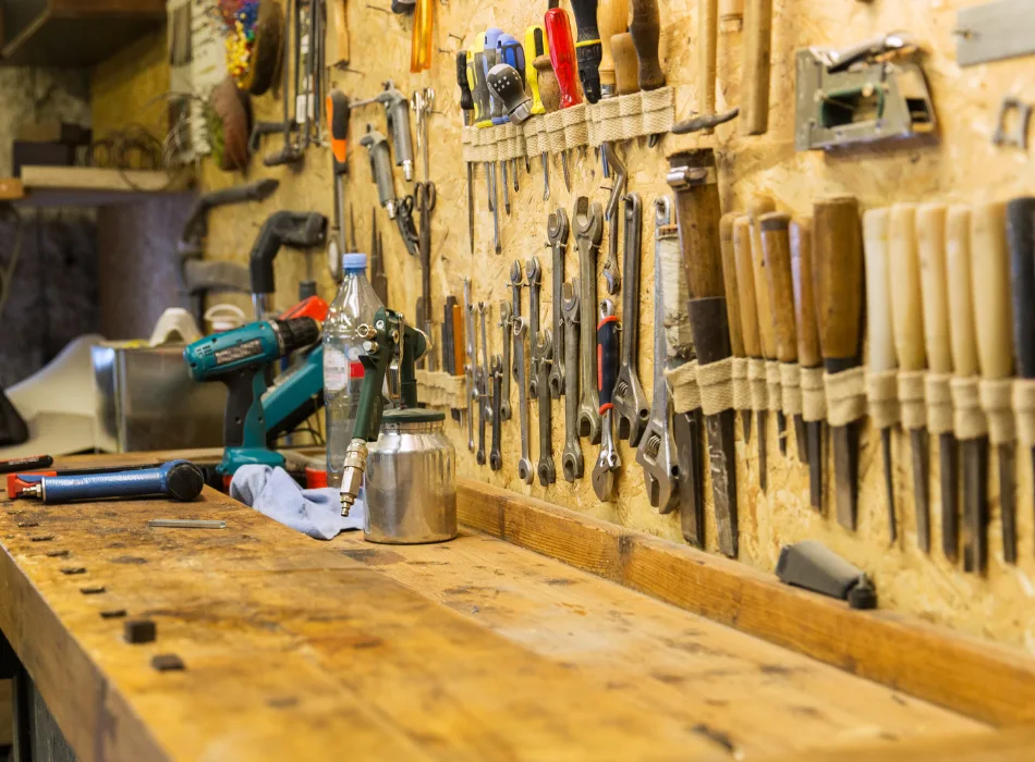 A workbench with many tools around it