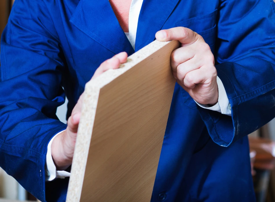 Man holding a plywood