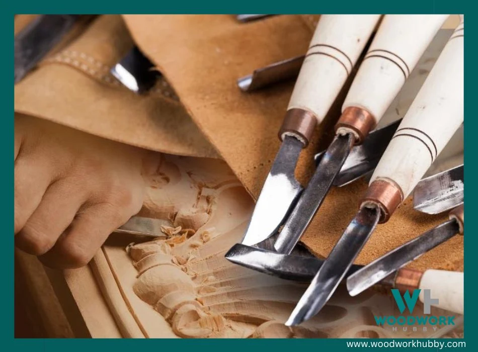 A set of carving chisels with wood being carved on background.