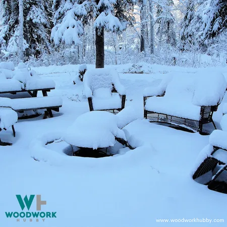Outdoor furniture covered with snow