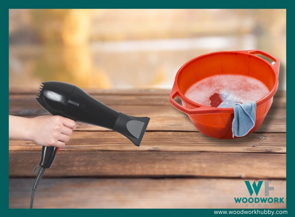 Using a hairdryer and warm soapy water